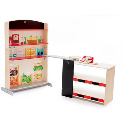 Setup de tienda pop-up Hape con estantes y caja, ideal para cocinitas de madera